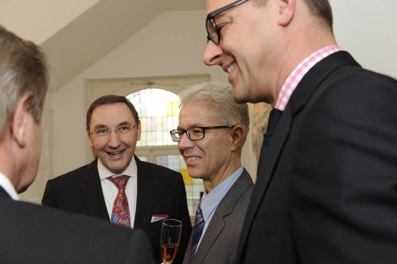 Dr. Weitz mit 3 Geschäftspartnern